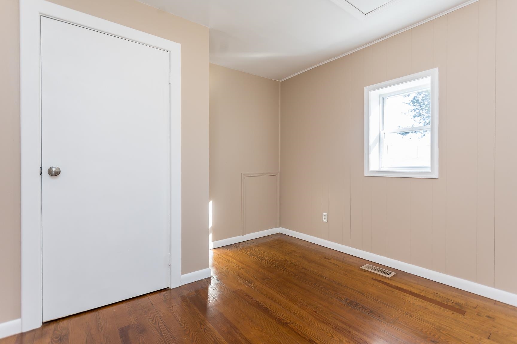 7176 Winestore Road Timberville, VA 22853 - Photo 11 of 45 an empty room with wooden floor and windows