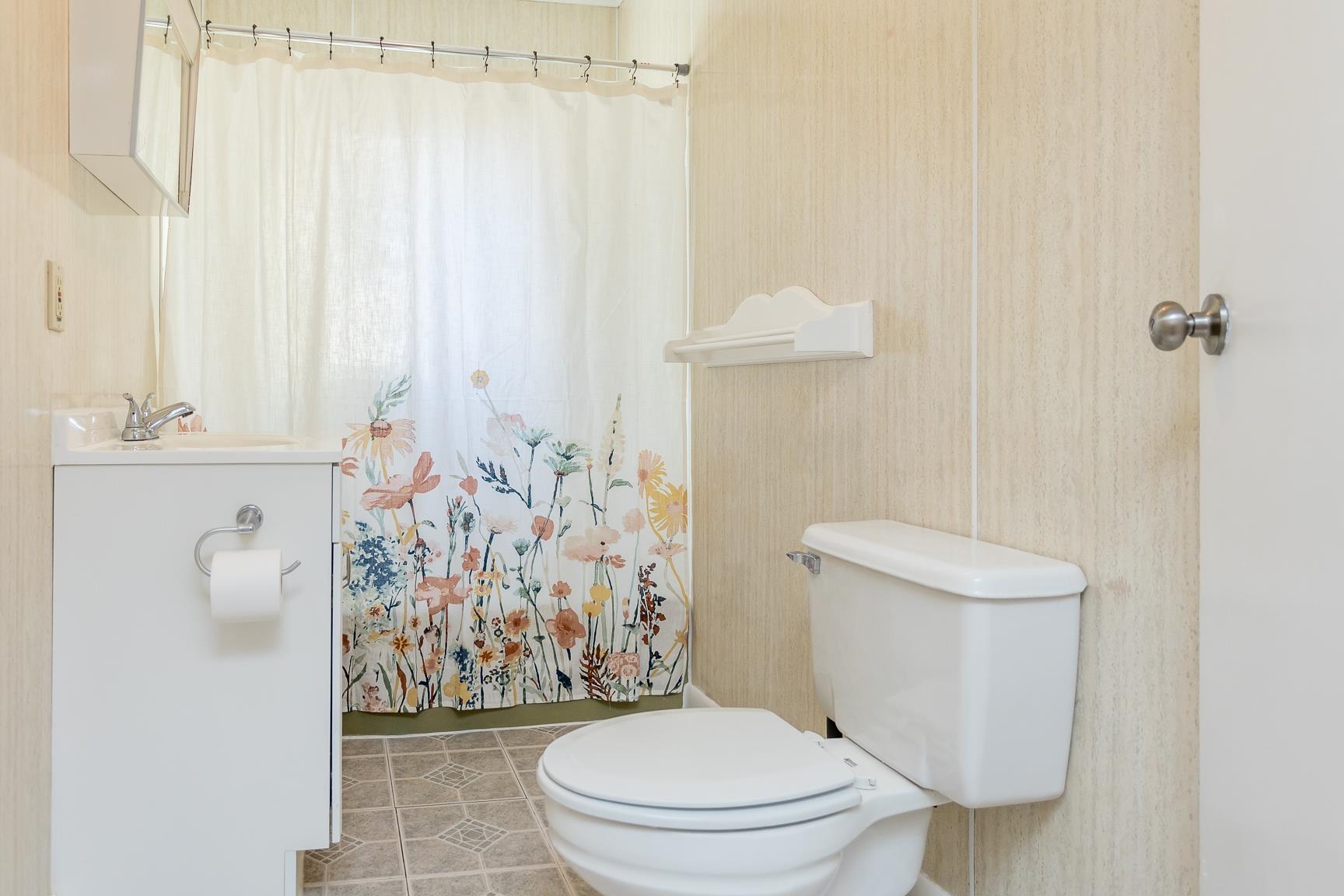 7176 Winestore Road Timberville, VA 22853 - Photo 12 of 45 a white toilet sitting next to a shower curtain