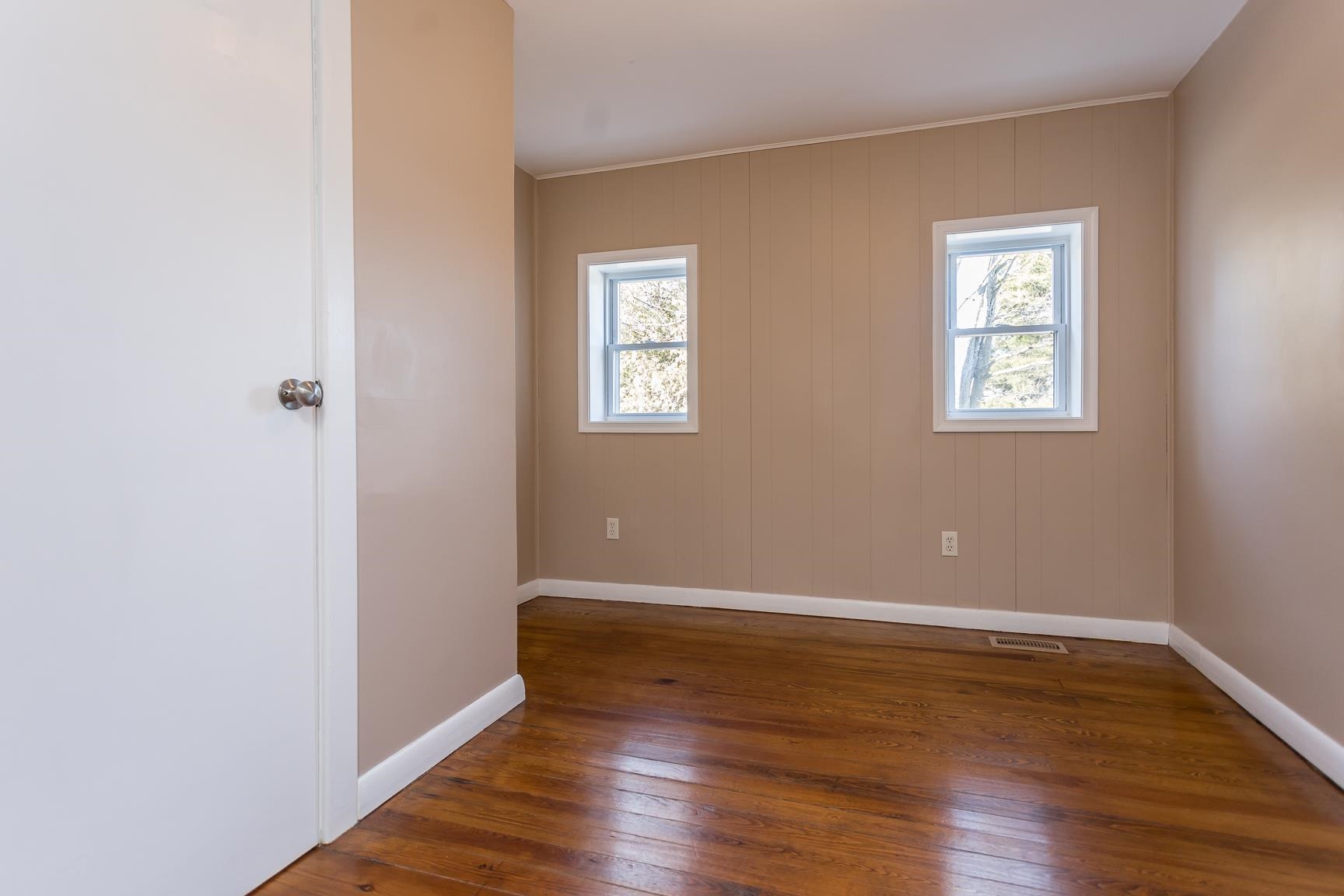 7176 Winestore Road Timberville, VA 22853 - Photo 15 of 45 an empty room with wooden floor and windows