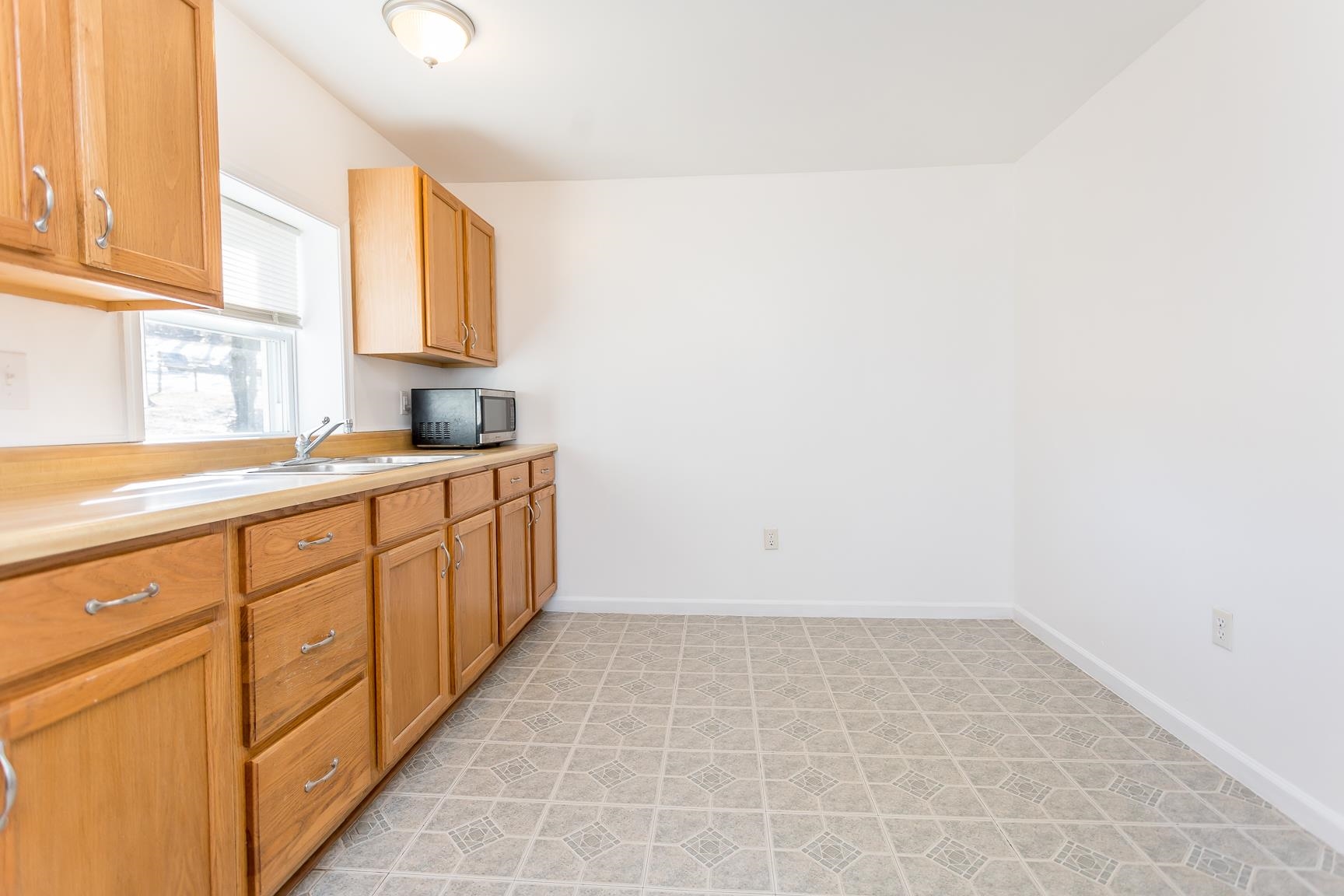 7176 Winestore Road Timberville, VA 22853 - Photo 19 of 45 a kitchen with a sink and cabinets