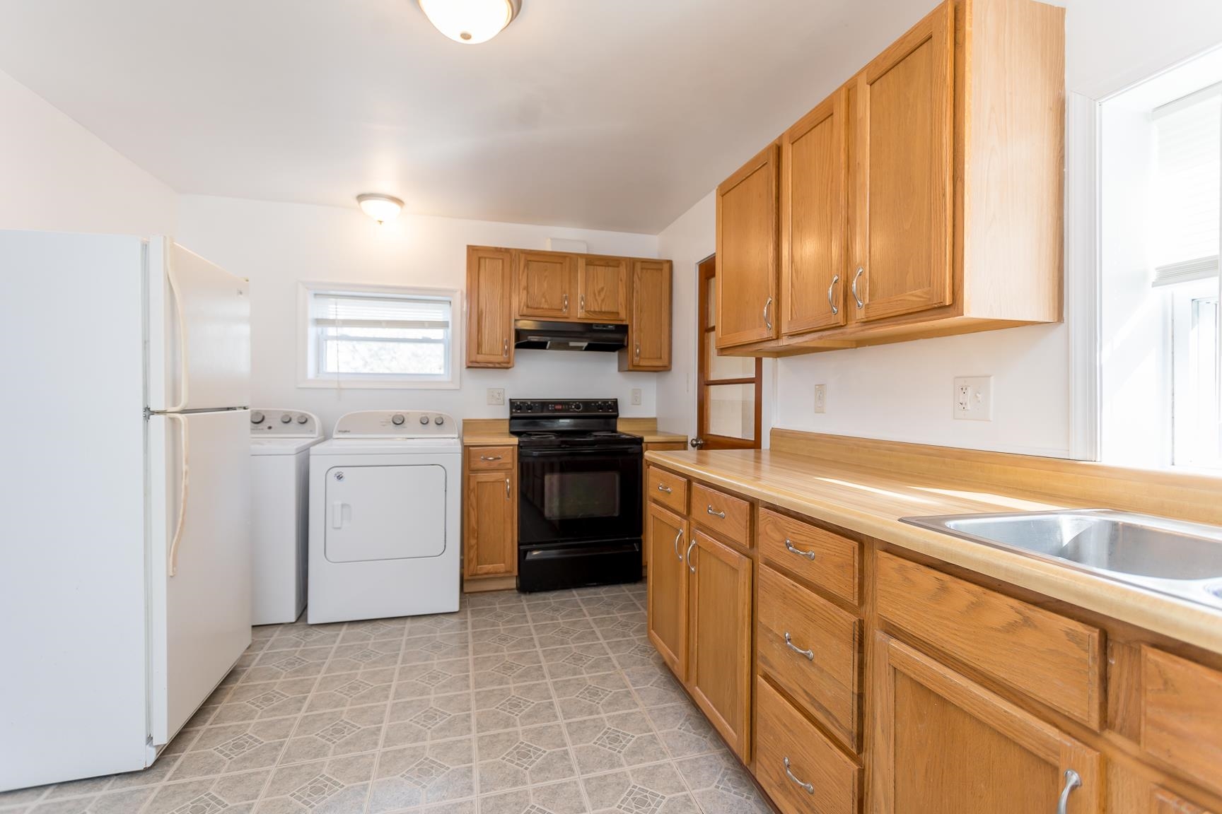 7176 Winestore Road Timberville, VA 22853 - Photo 20 of 45 a kitchen with a sink stove and cabinets