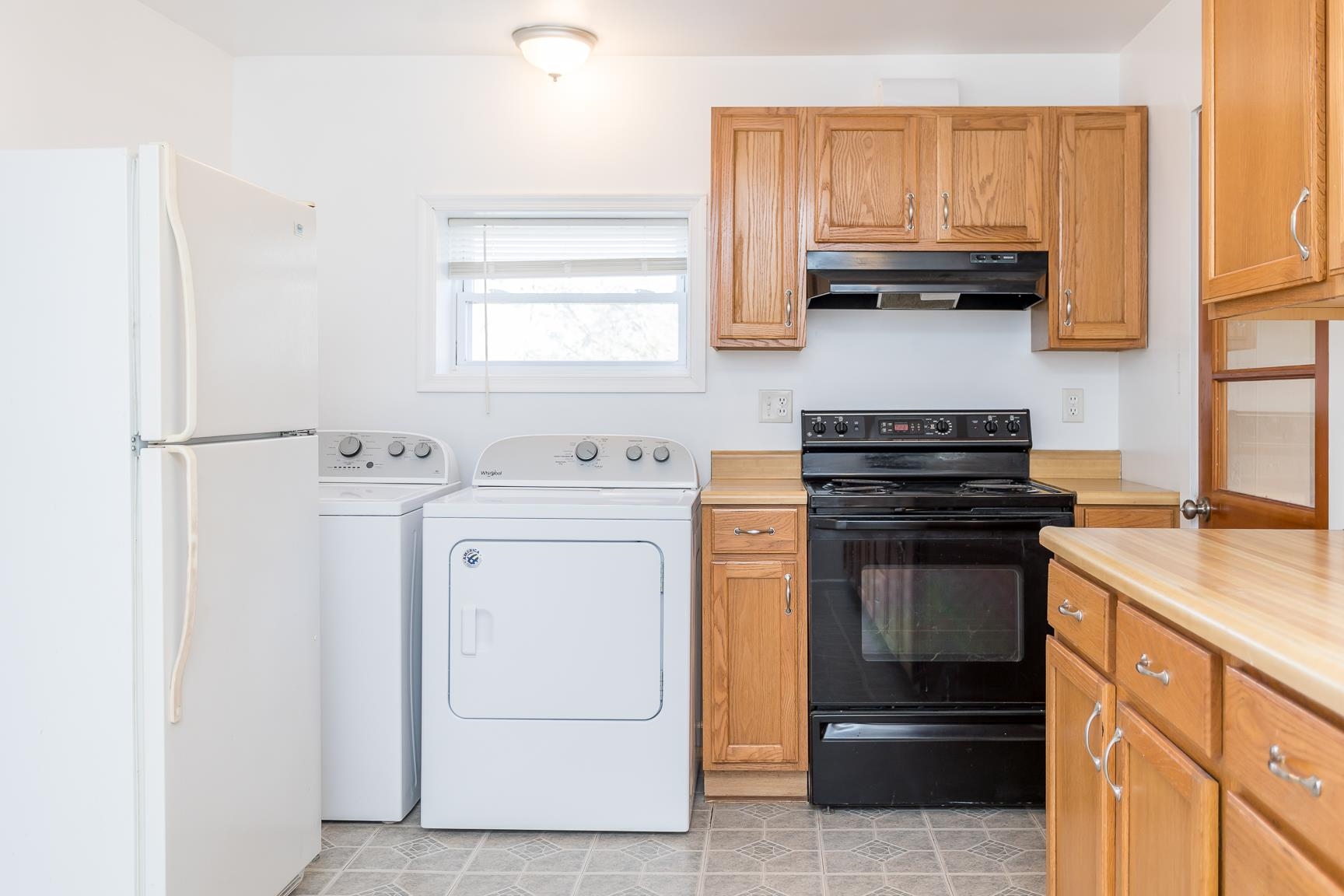 7176 Winestore Road Timberville, VA 22853 - Photo 21 of 45 a kitchen with appliances cabinets and a window