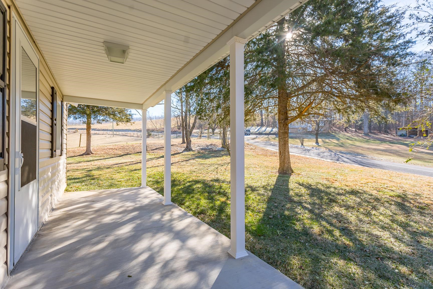 7176 Winestore Road Timberville, VA 22853 - Photo 6 of 45 a view of a porch and a yard