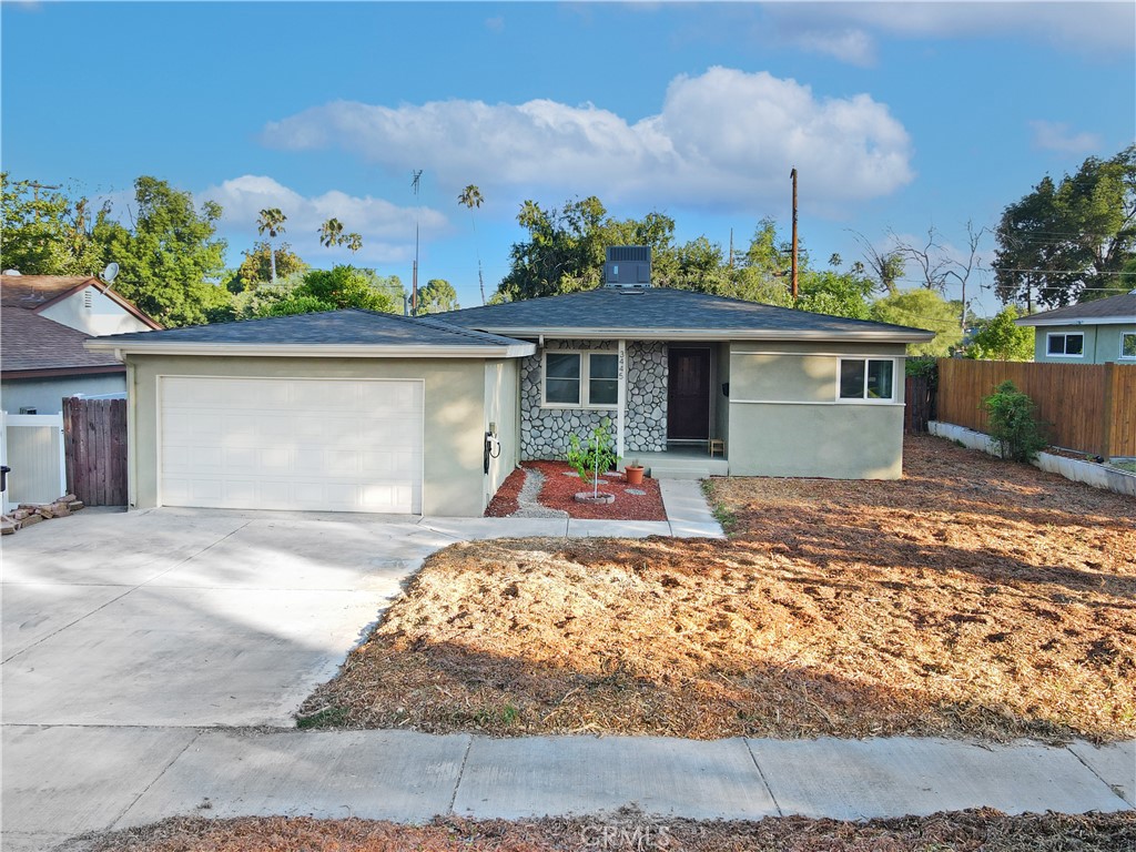 3445 Tipperary Way Riverside, CA 92506 - Photo 1 of 26 a front view of a house with a yard and potted plants