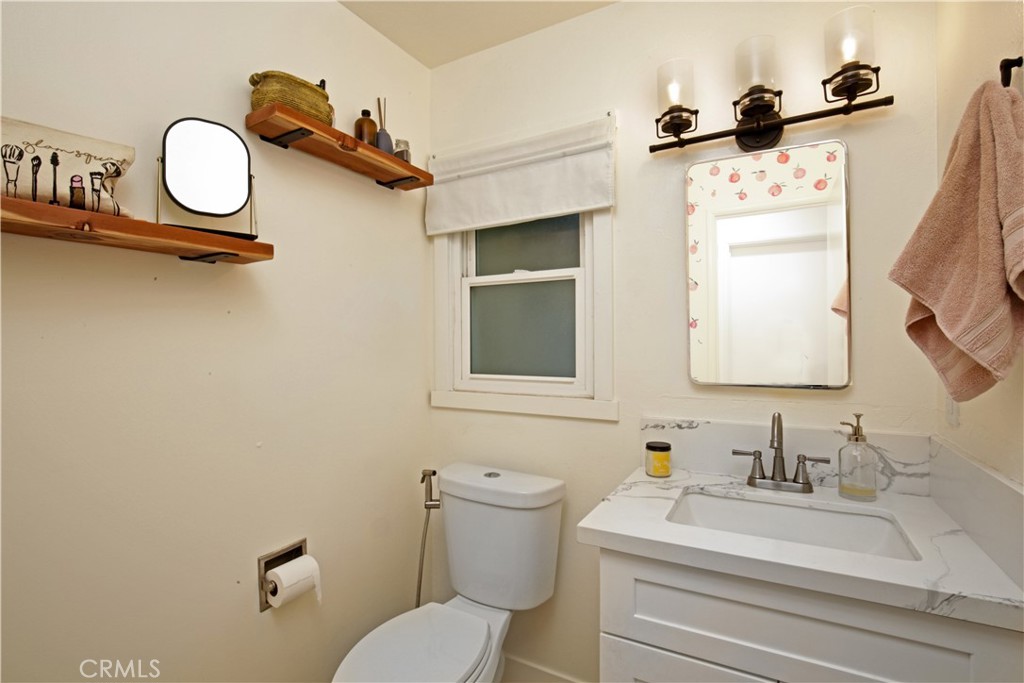 3445 Tipperary Way Riverside, CA 92506 - Photo 11 of 26 a bathroom with a sink mirror vanity and toilet