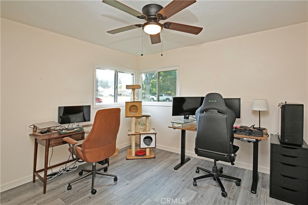 3445 Tipperary Way Riverside, CA 92506 - Photo 13 of 26 a view of a workspace with furniture and a window