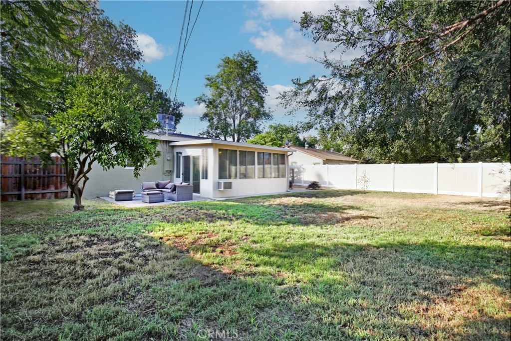 3445 Tipperary Way Riverside, CA 92506 - Photo 20 of 26 a view of a house with backyard and a tree