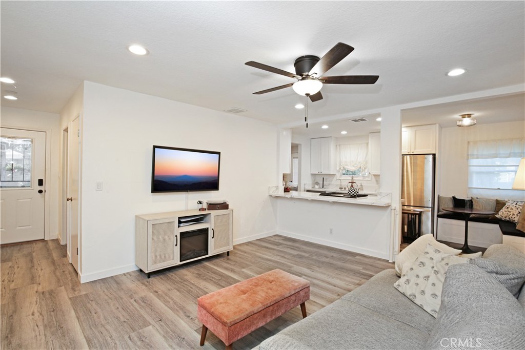 3445 Tipperary Way Riverside, CA 92506 - Photo 5 of 26 a living room with furniture and a flat screen tv