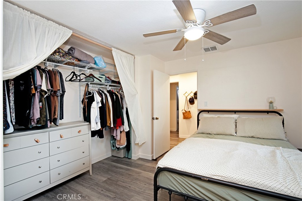 3445 Tipperary Way Riverside, CA 92506 - Photo 10 of 26 a bedroom with a bed and a walk in closet