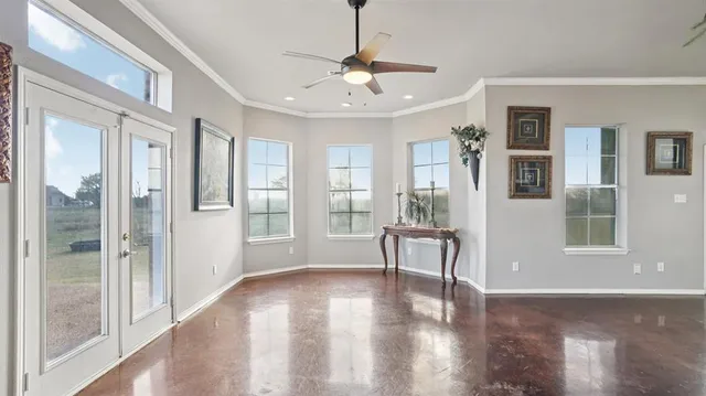 a view of livingroom with hardwood floor and a ceiling fan