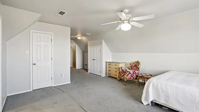 a bed room with a bed and a chandelier