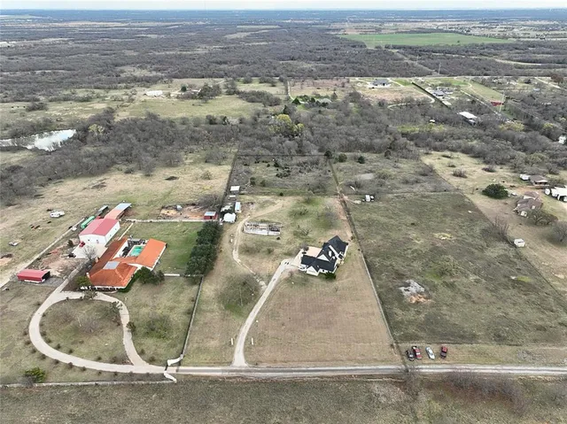 an aerial view of a house with a outdoor space