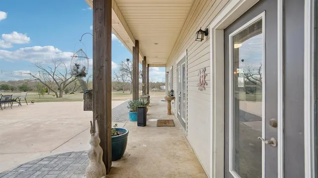 a view of a swimming pool and outdoor seating