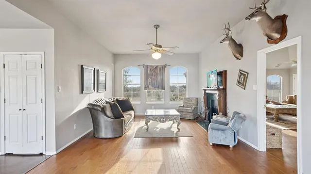 a living room with furniture or couch and a chandelier