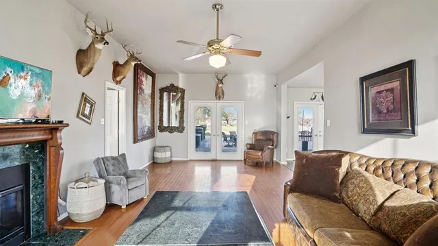 a living room with furniture a fireplace and decor