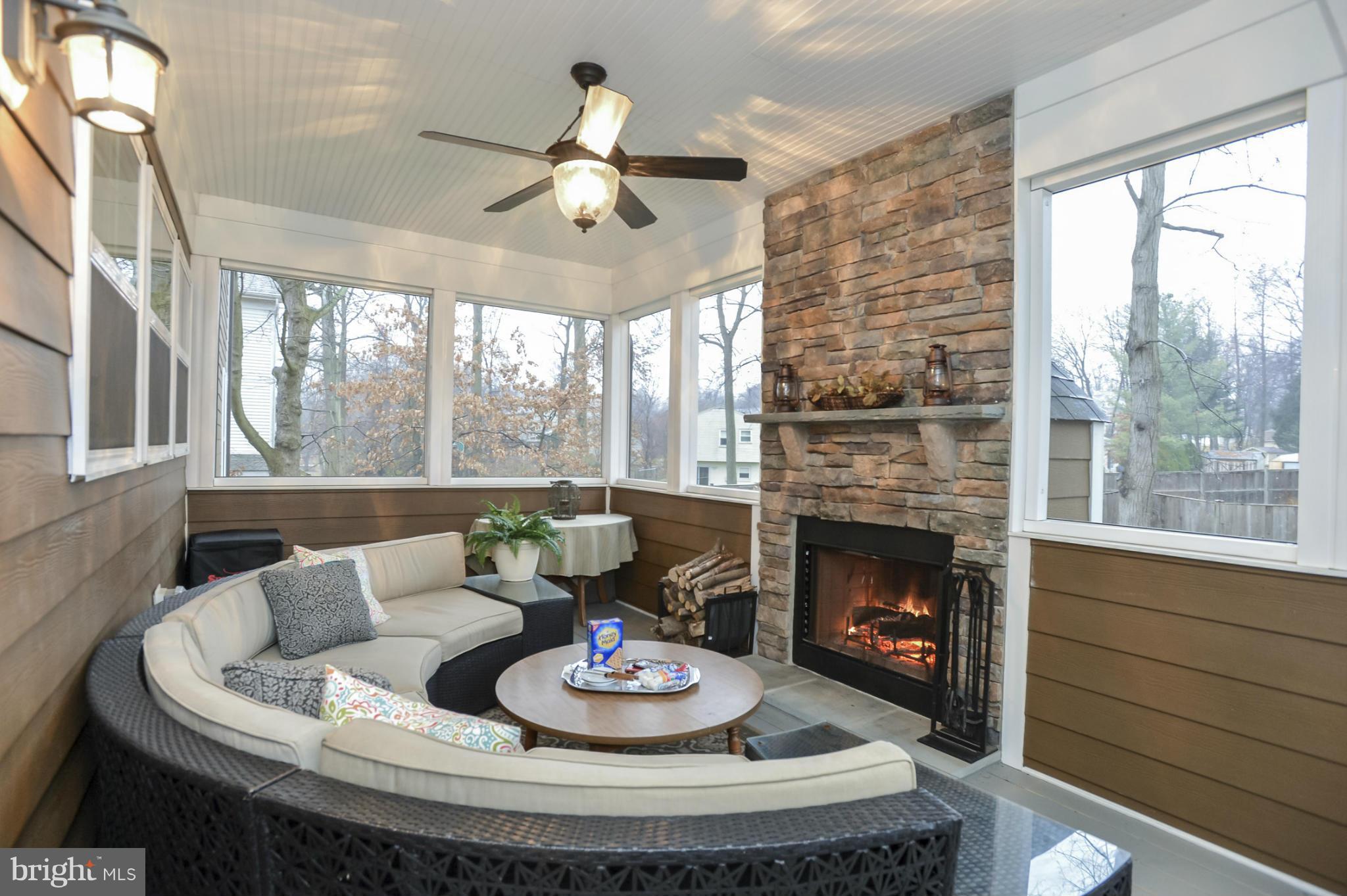 224 Tapawingo Road Southeast Vienna, VA 22180 - Photo 29 of 30 Screened-in porch with stone fireplace