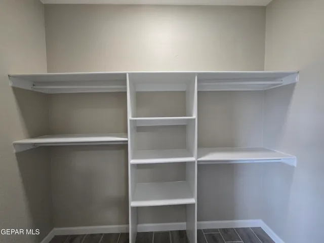 a view of an empty walk in closet