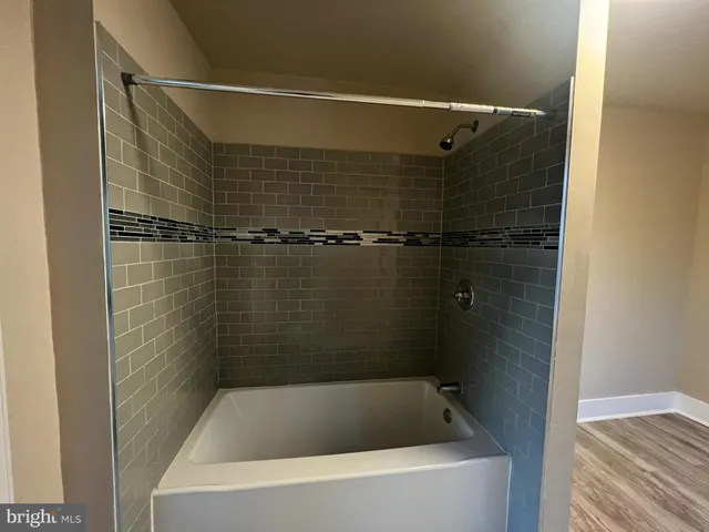 a bathroom with a bath tub