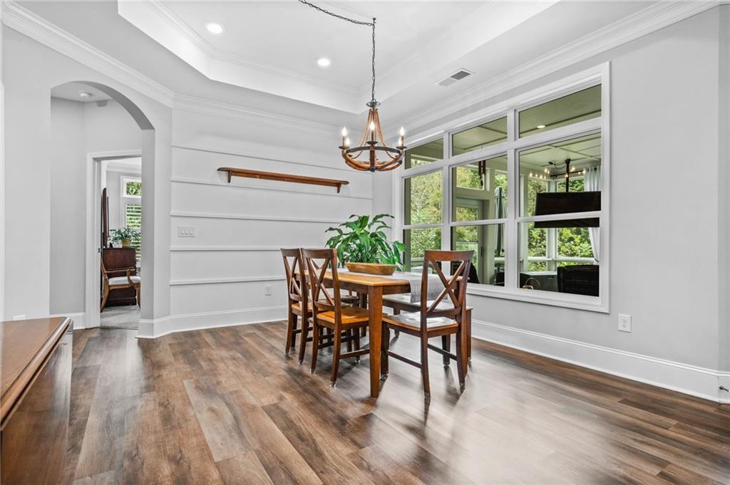 4883 Pleasantry Way Northwest Acworth, GA 30101 - Photo 17 of 46 a dining room with furniture window entryway and wooden floor