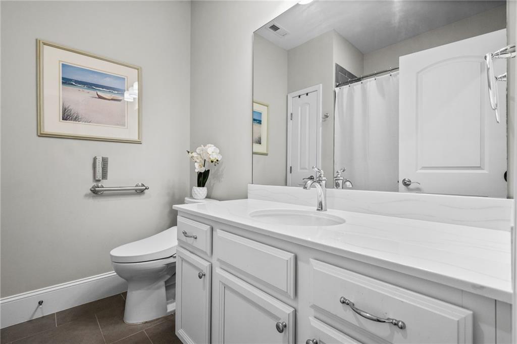4883 Pleasantry Way Northwest Acworth, GA 30101 - Photo 26 of 46 a bathroom with a toilet sink and mirror