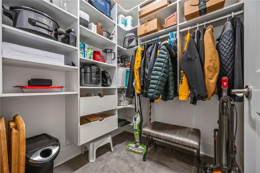 4883 Pleasantry Way Northwest Acworth, GA 30101 - Photo 30 of 46 a view of walk in closet with clothes and shoes