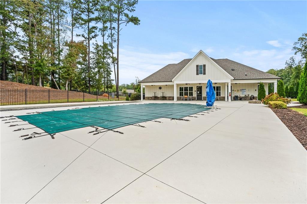 4883 Pleasantry Way Northwest Acworth, GA 30101 - Photo 46 of 46 a front view of a house with a yard and potted plants
