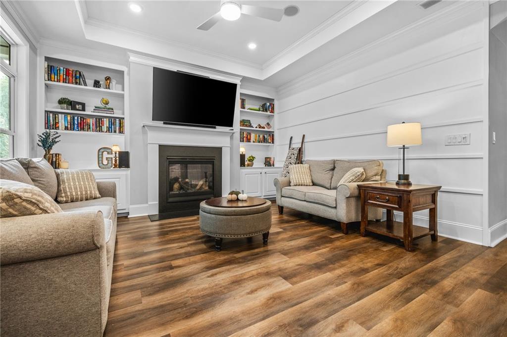 4883 Pleasantry Way Northwest Acworth, GA 30101 - Photo 7 of 46 a living room with furniture a fireplace and a flat screen tv