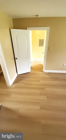 a view of a big room with wooden floor