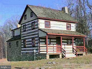 1981 Sinsheim Road Spring Grove, PA 17362 - Photo 1 of 1 a front view of a house with garden