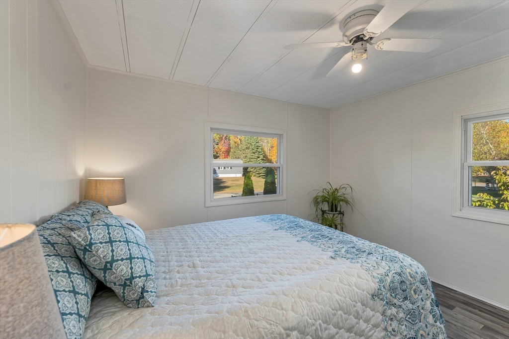 28 Brooks Road, Unit 28 Seabrook, NH 03874 - Photo 17 of 34 a bedroom with a bed and a window