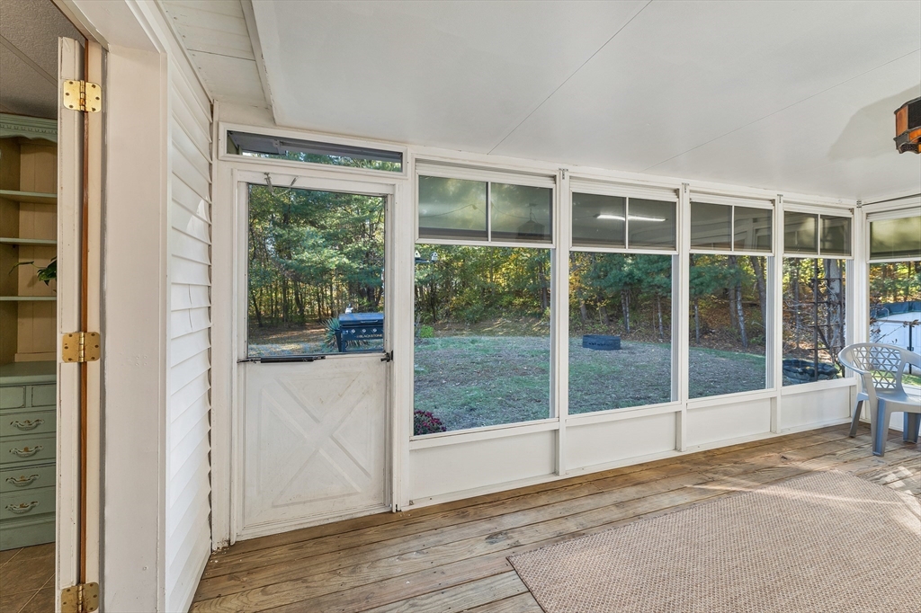 28 Brooks Road, Unit 28 Seabrook, NH 03874 - Photo 24 of 34 a view of an empty room with wooden floor and glass door