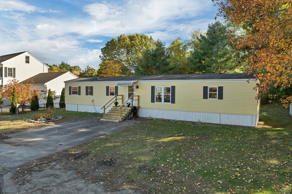 28 Brooks Road, Unit 28 Seabrook, NH 03874 - Photo 26 of 34 a view of a house with a yard