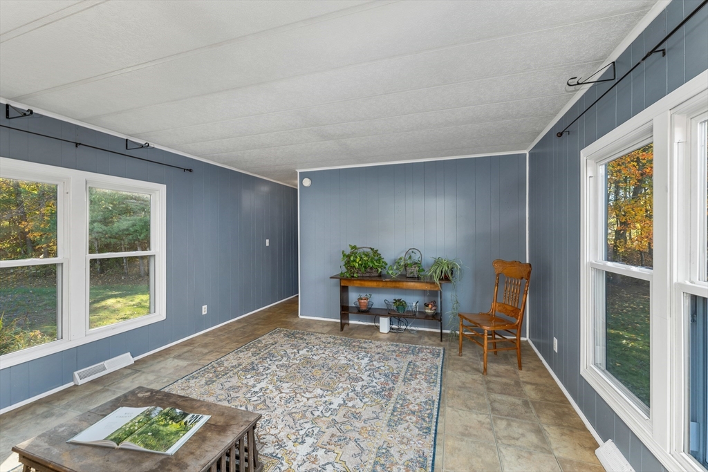 28 Brooks Road, Unit 28 Seabrook, NH 03874 - Photo 8 of 34 a view of workspace with furniture and window