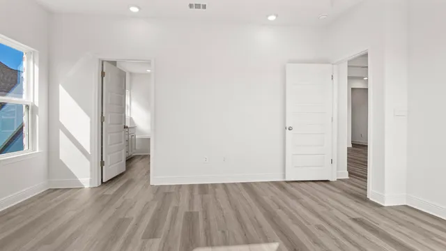 a bathroom with a sink a large mirror and shower