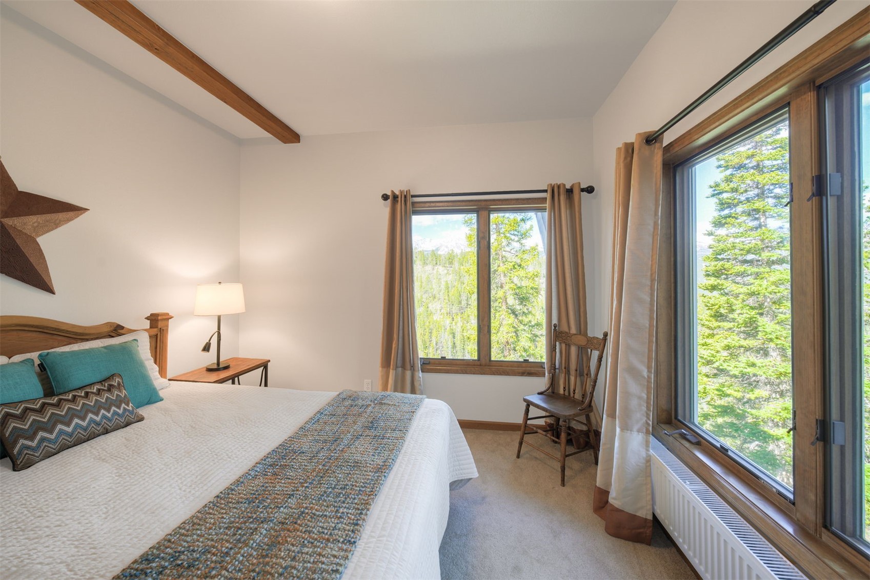 2542 Boreas Pass Road Breckenridge, CO 80424 - Photo 23 of 33 a bedroom with a bed and a large window