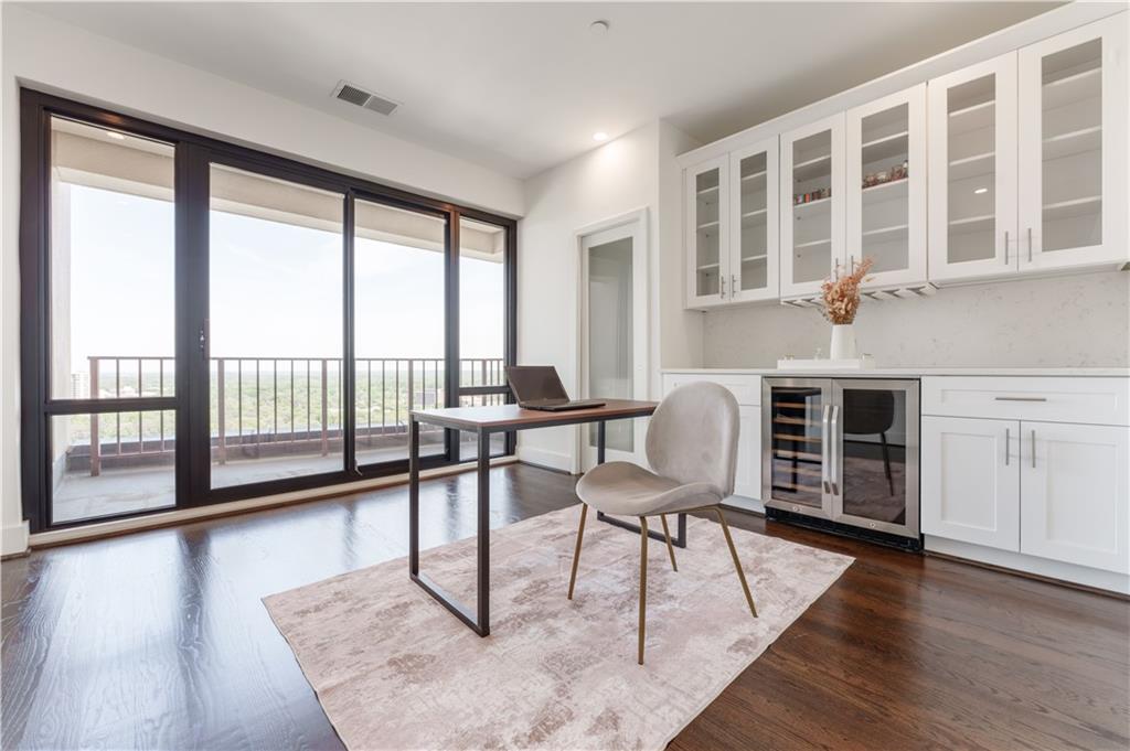 3475 Oak Valley Road Northeast, Unit 2940 Atlanta, GA 30326 - Photo 11 of 26 a living room with furniture and a large window