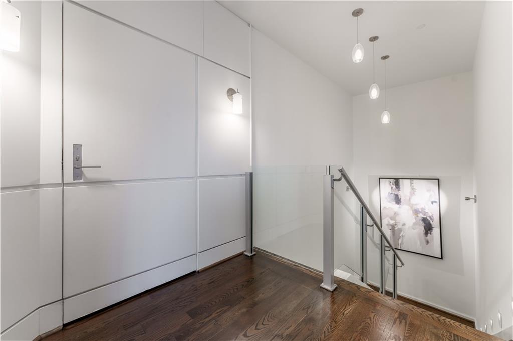3475 Oak Valley Road Northeast, Unit 2940 Atlanta, GA 30326 - Photo 18 of 26 a view of a hallway with wooden floor