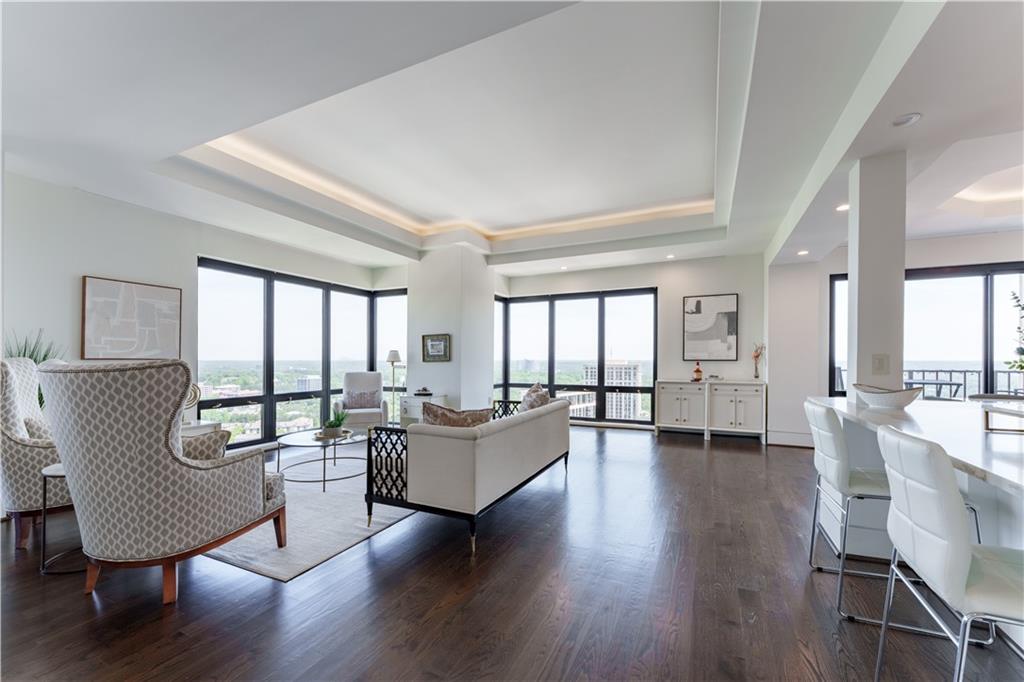 3475 Oak Valley Road Northeast, Unit 2940 Atlanta, GA 30326 - Photo 19 of 26 a living room with furniture and a large window