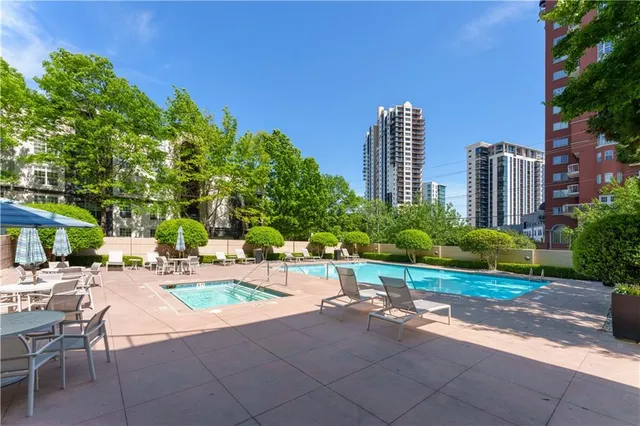 a wooden bench sitting in front of a building