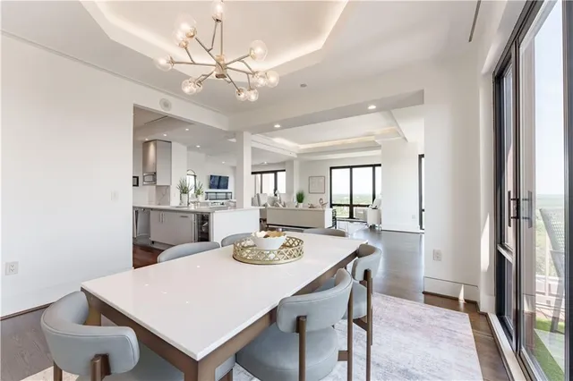 a open dining room with a table and chairs