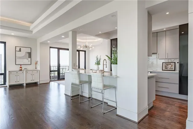 a view of an entryway with wooden floor and windows