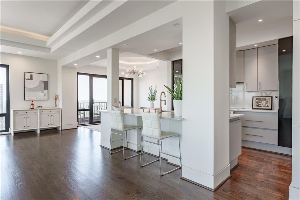 3475 Oak Valley Road Northeast, Unit 2940 Atlanta, GA 30326 - Photo 8 of 26 a view of an entryway with wooden floor and windows