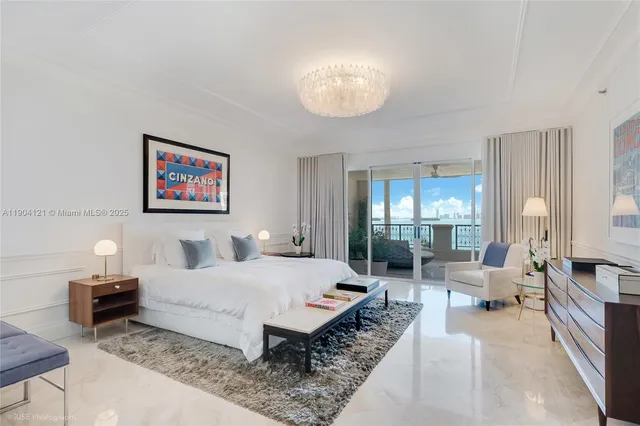 a bedroom with bed and large windows