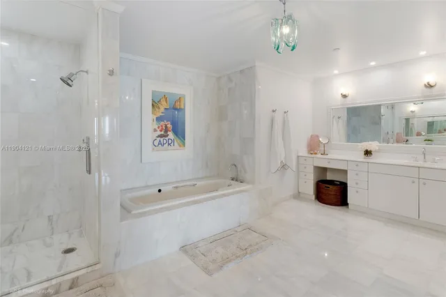 a bathroom with a tub sink and mirror
