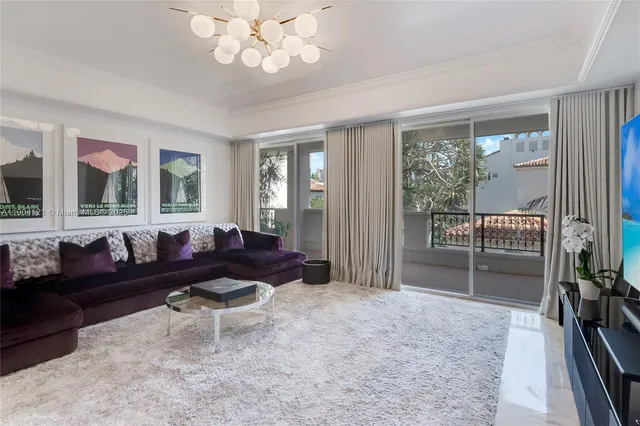 a living room with furniture a rug and a fireplace