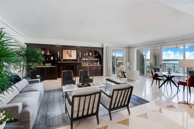 a dining room with furniture a fireplace and wooden floor