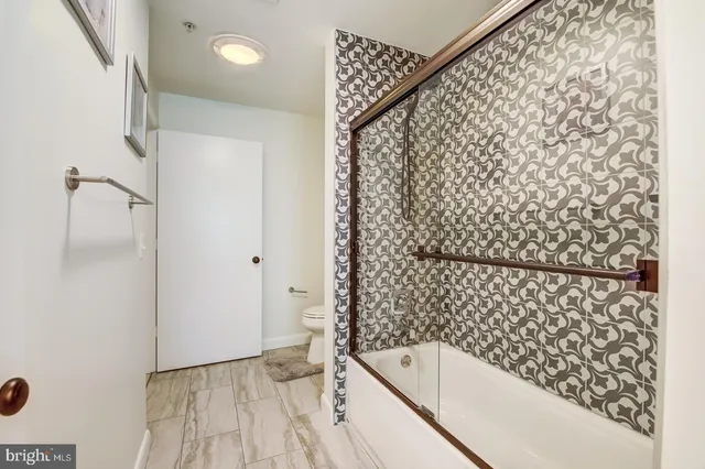 a bathroom with a bathtub and shower