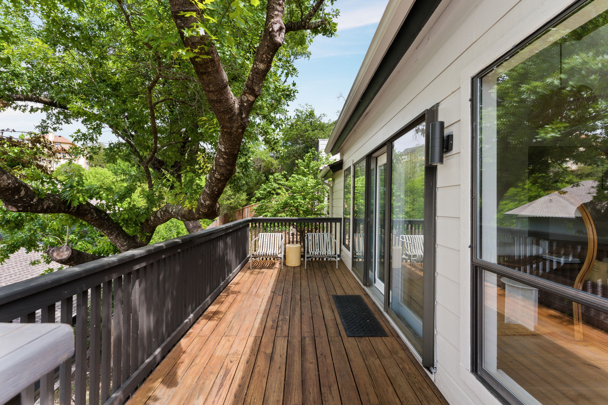 9101 Echo Point Cove Austin, TX 78759 - Photo 11 of 34 a view of balcony with wooden floor and fence