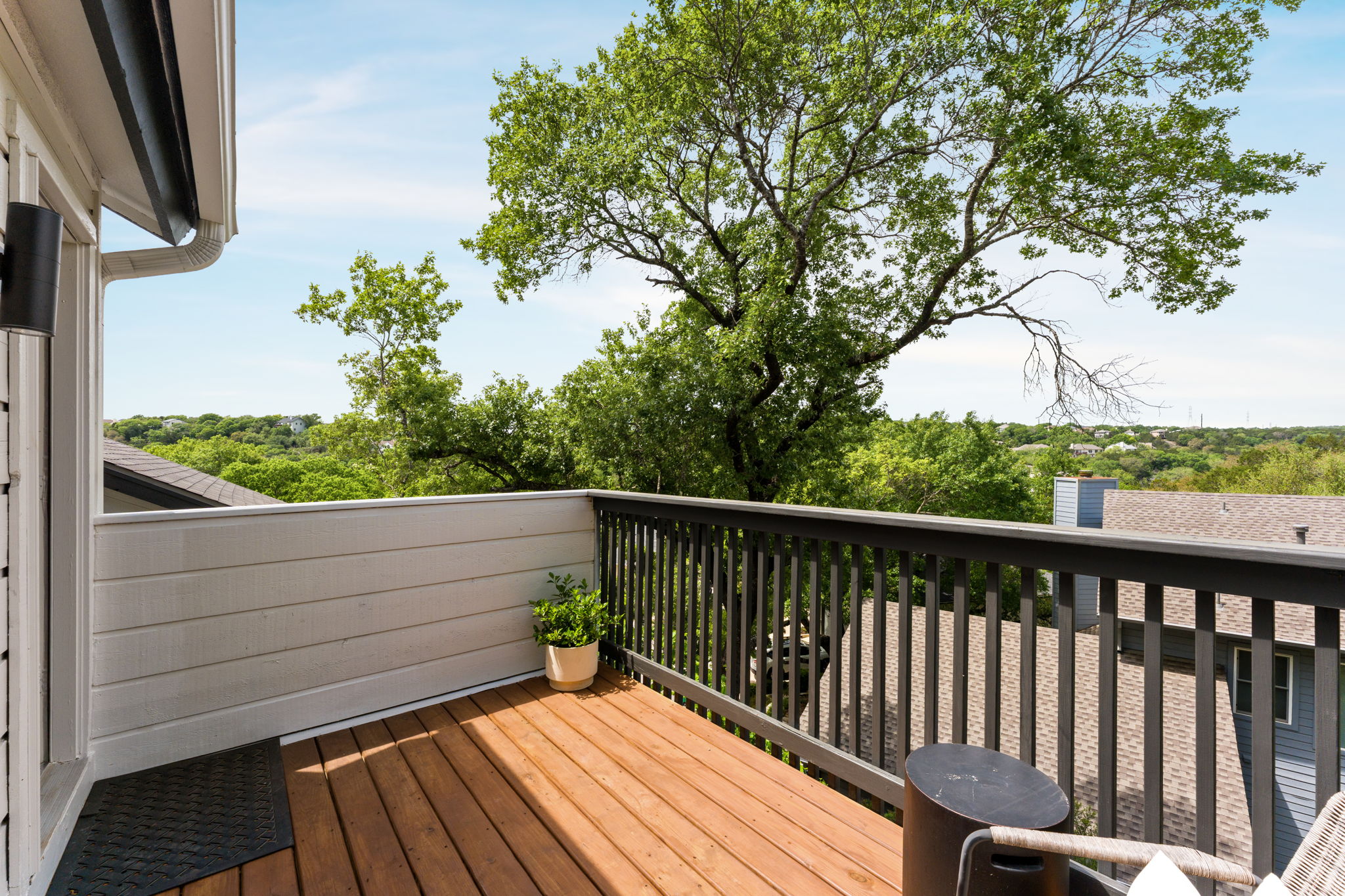9101 Echo Point Cove Austin, TX 78759 - Photo 21 of 34 a view of balcony with wooden floor and fence