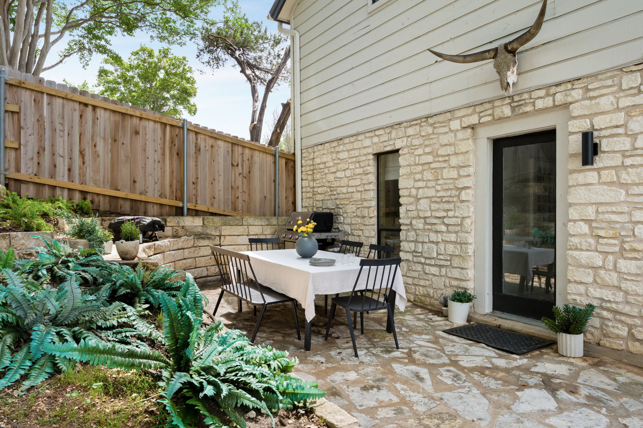 9101 Echo Point Cove Austin, TX 78759 - Photo 31 of 34 a view of a patio with table and chairs and potted plants